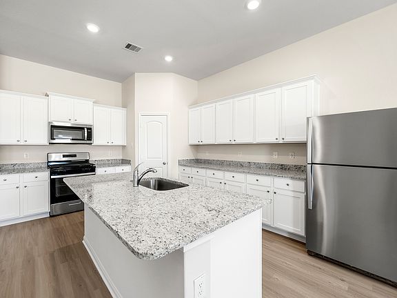 Enjoy a full suite of appliances by Whirlpool in this move-in ready home