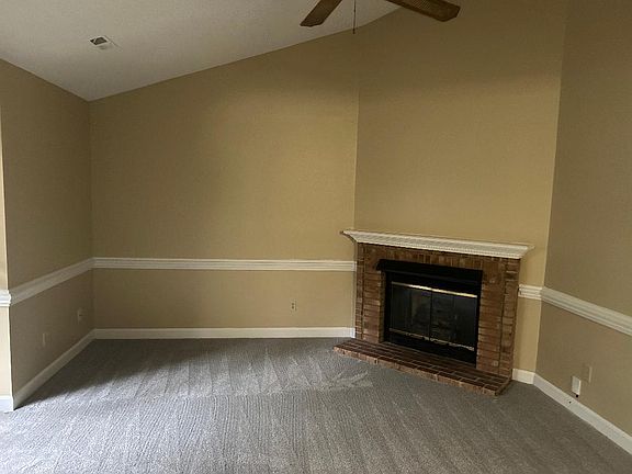 Fresh paint and new carpet with a gas fireplace in the den- great space for entertaining.