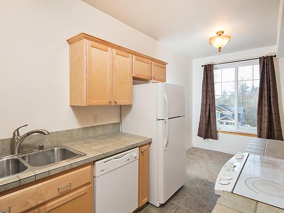 Kitchen is open to the living room, and to the nook with lar