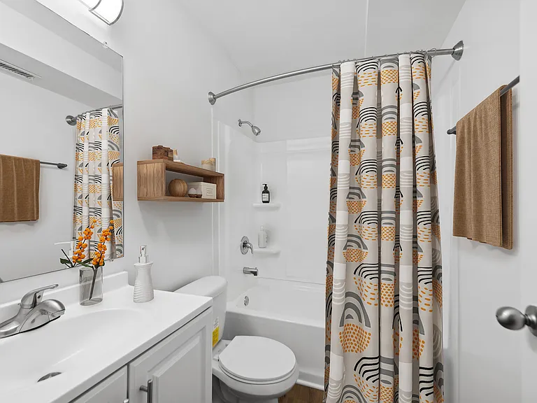 Experience modern elegance in this well-lit bathroom featuring sleek fixtures and stylish accents. Experience modern elegance in this well-lit bathroom featuring sleek fixtures and stylish accents.