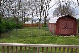 Talk about a yard to play in! This is it! Flat & treed - how about croquet or 