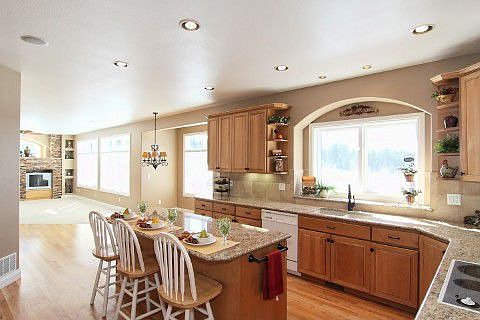 Gourmet kitchen w/slab granite counters & tile backsplash