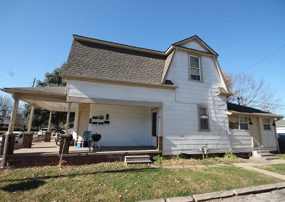 Unit # 3 door is on the far right. Shared front porch w/ swing.