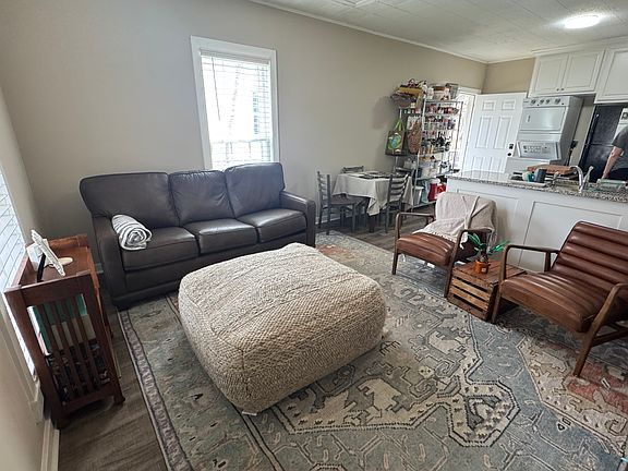 Open, airy and light. Floor plan excellent for entertaining. Living area opens into large kitchen: granite countertops, all the appliances including dishwasher, disposal, microwave, custom white cabinets.