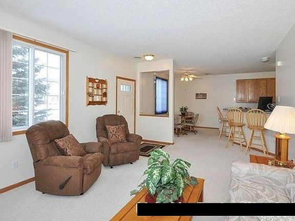 Large living room with fireplace and dining room