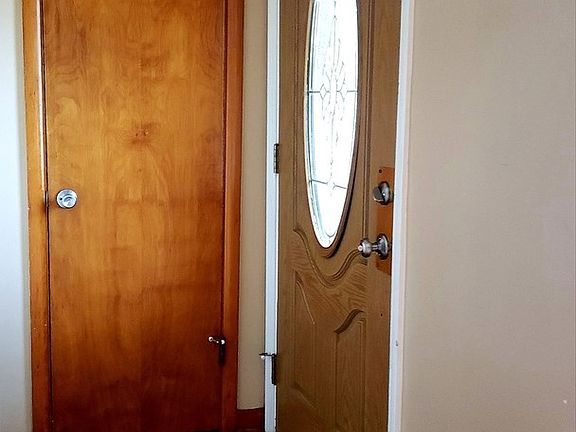 Front door and coat closet