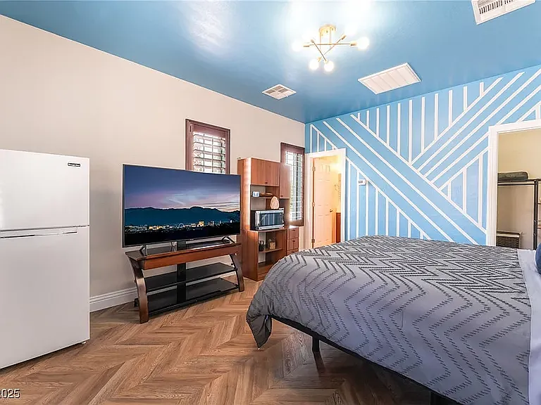 Large flat screen tv, microwave, coffee maker, air-fryer and apartment size fridge.