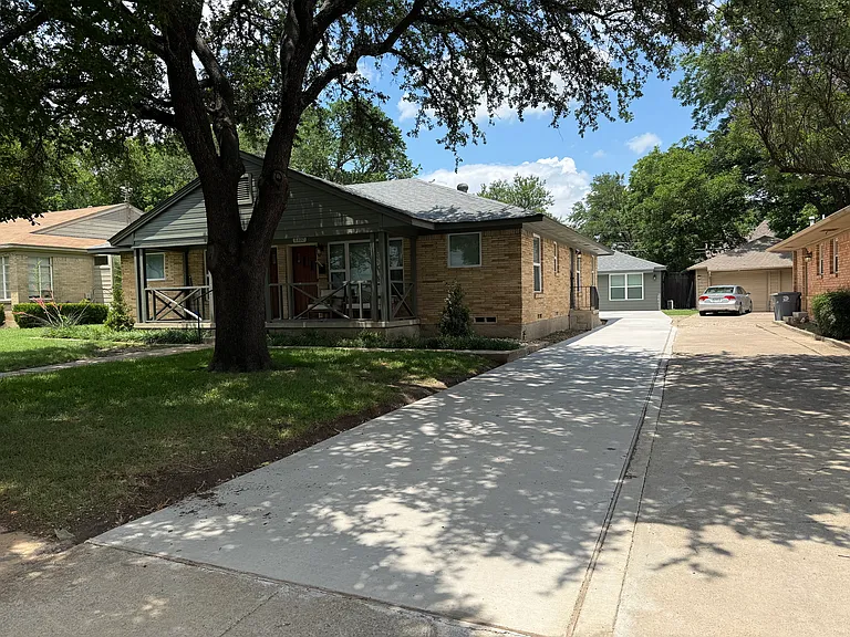 New concrete driveway, mature trees