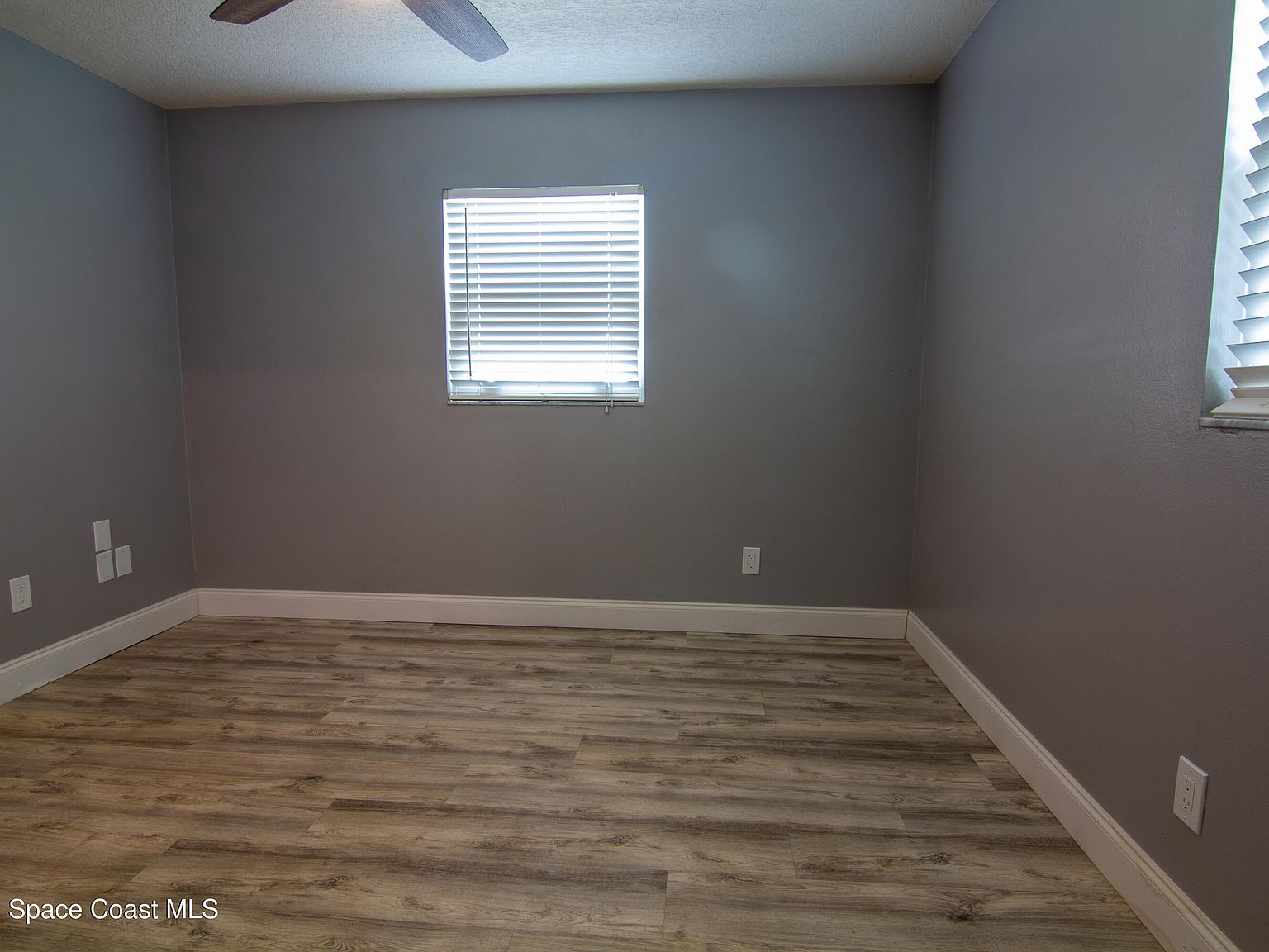 Comfortable secondary bedroom with natural light