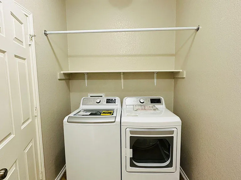Laundry with brand new washer and dryer