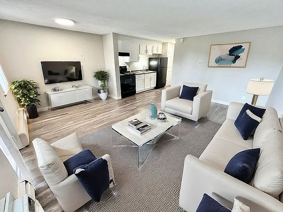 Embrace comfort in this contemporary living room, perfect for relaxation and social gatherings.