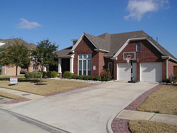 Front view of home. Garage has a large storage closet (room size) and a converted workout/craft/man-cave room.