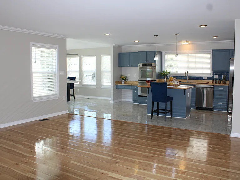 View of spacious family room and kitchen