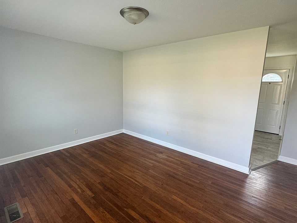 Living room, has large picture window with plenty of light!