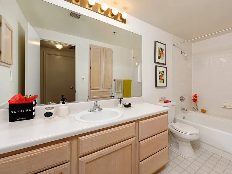 Classic Package I bath with white countertops and oak cabinetry