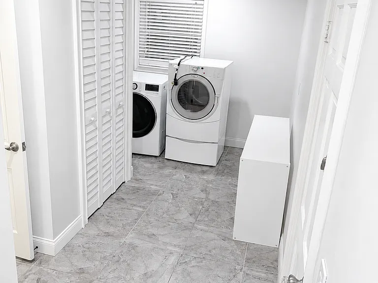 Laundry room and half bathroom off of kitchen