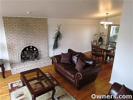 Living room, dining area, view to patio