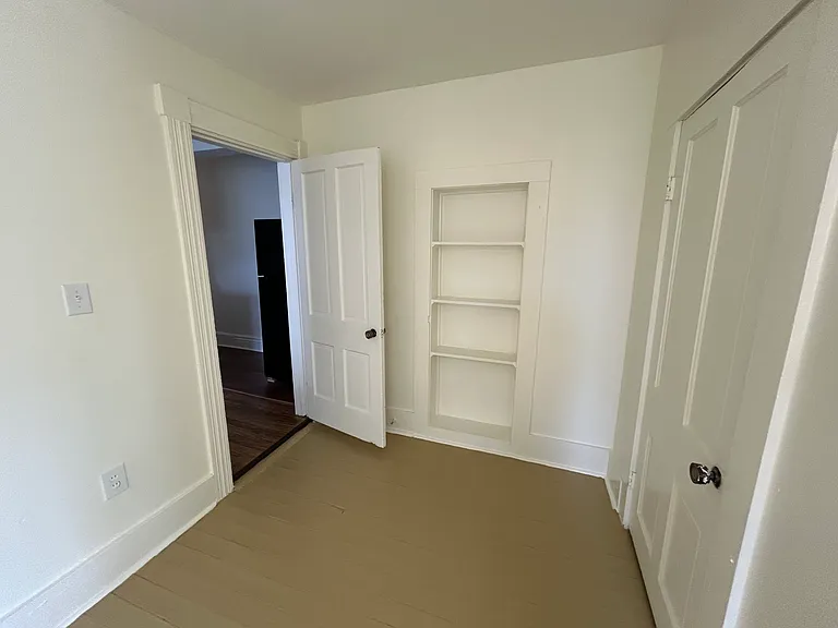 Nice built ins in the bedroom with original solid wood doors