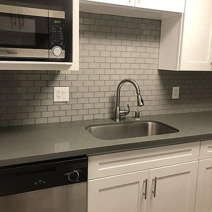 Granite countertops and stainless steel appliances.