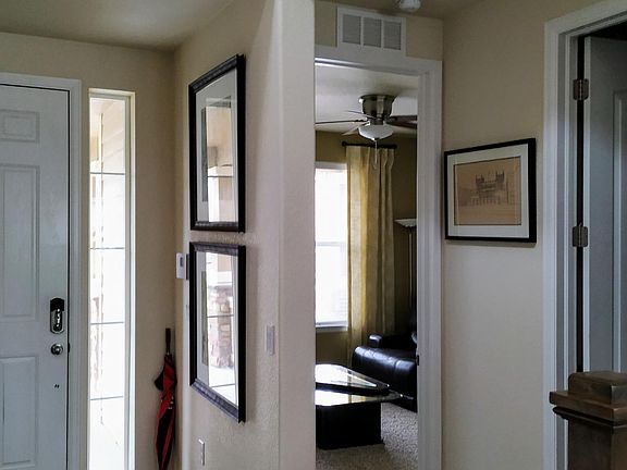 Entryway, view to downstairs bedroom/study