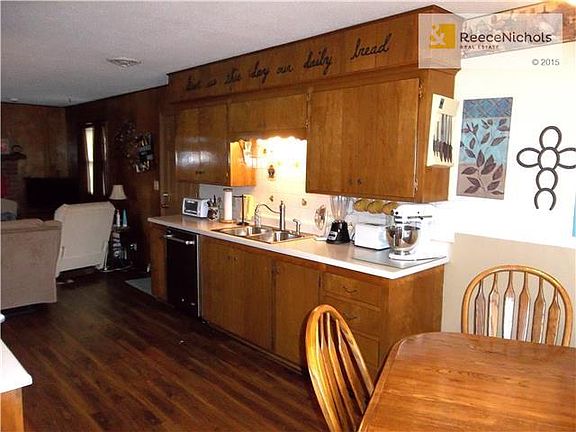 Kitchen cabinets and newer sink faucet.