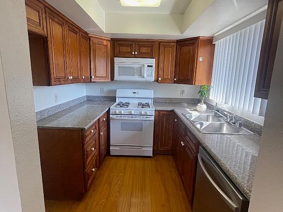 Kitchen with Microwave, Stove, Dishwasher.