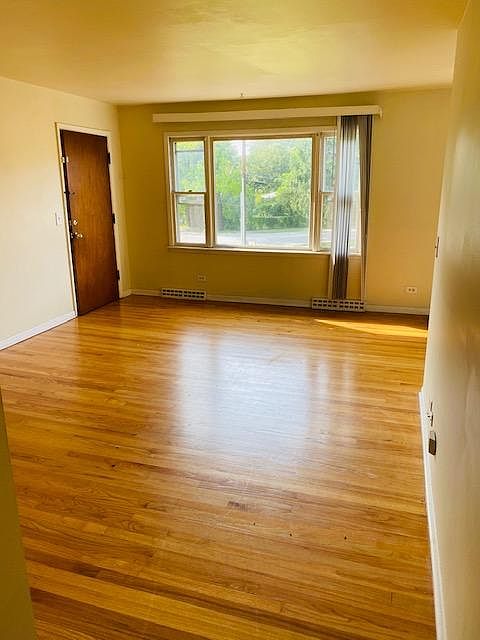 HUGE living room, picture window and hardwood floors