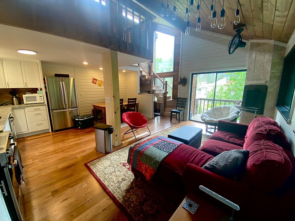 Cozy gas fireplace for cool rainy days. Porch and stairwell windows face north with up valley mountain views.
