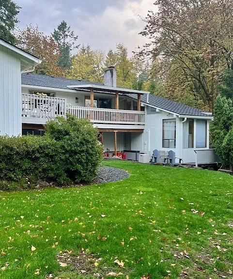 Back yard. Exterior w/ 2 Decks: Main home above and mother-in-law apartment / ADU bottom right. (Fall Season)