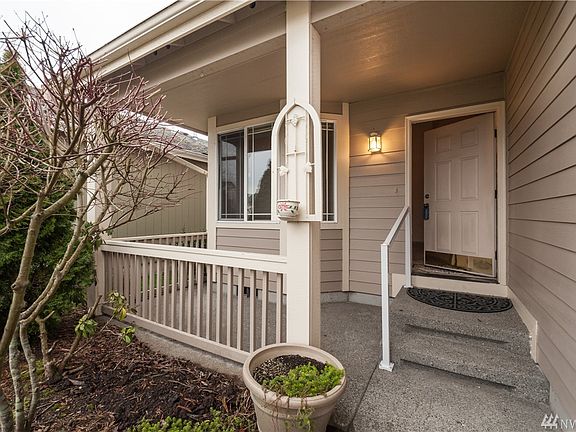 The covered porch provides an all-weather space for enjoyment. 