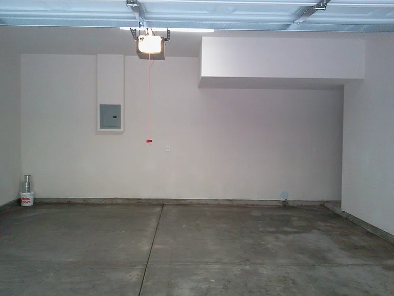 2 car garage - attached. Has storage space on the right under the stairs. Door in garage entrance directly into 1st floor.