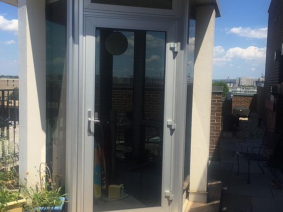 Cupola door in roof garden leads to spiral staircase down to living room