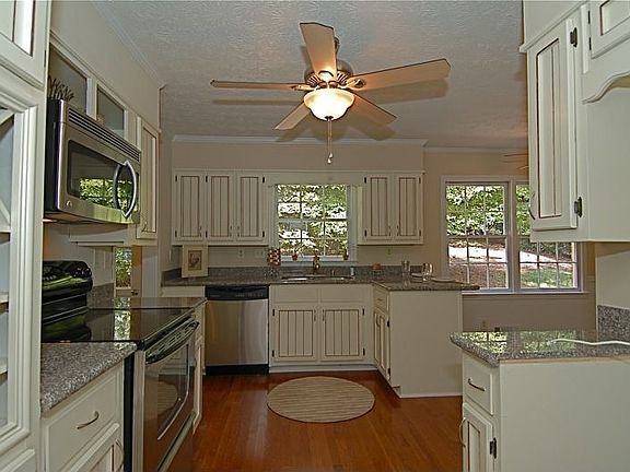 Updated cabinetry, wine rack, new light fixtures.