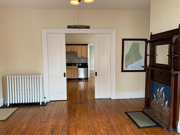 From the bay window looking back towards the kitchen, the french doors are 1/2 drawn.