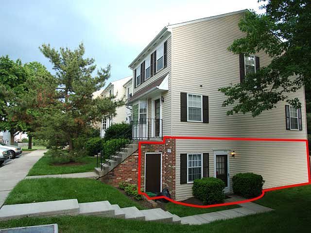 Condo is lower level end-unit, and width of two upstairs units.