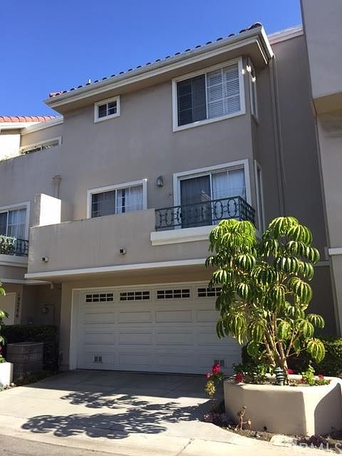 Two car attached garage provides direct access to the interior.