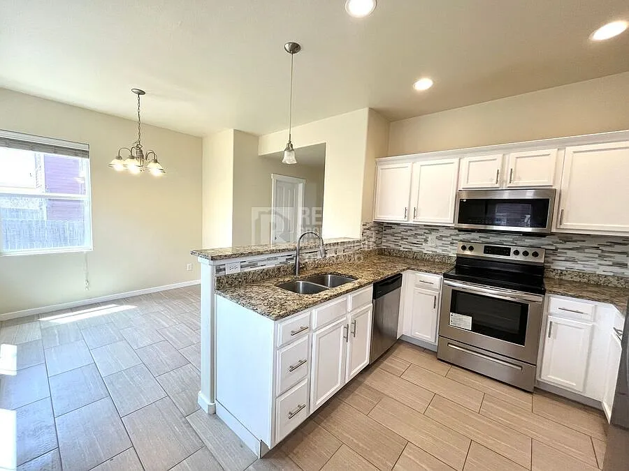 Inviting Home with Fireplace, Finished Basement & Private Fenced Outdoor Space — Photo 4