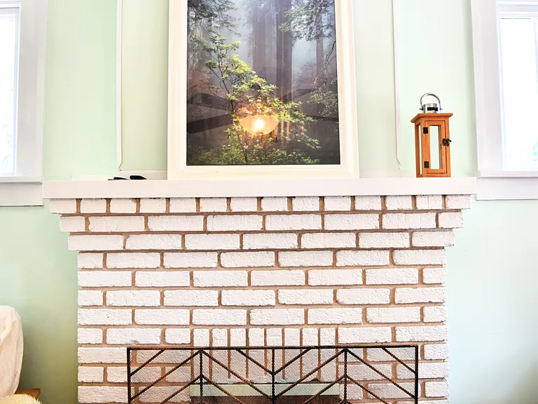 Beautiful fireplace with electric insert with remote