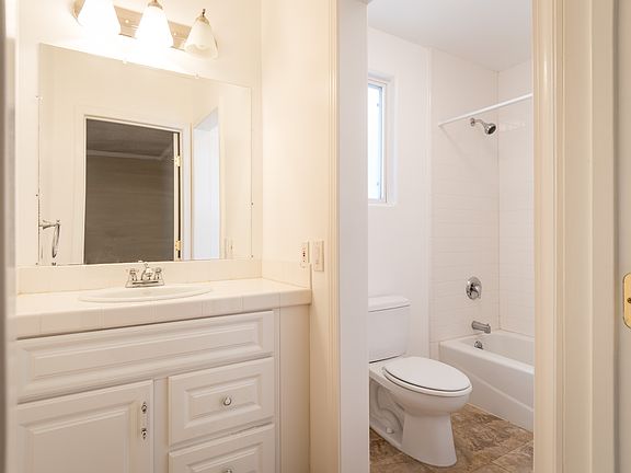 BATHROOM - LARGE VANITY -
LOTS OF CABINET SPACE AND COUNTERTOP
BRIGHT WHOTE SUBWAY TILE TUB/SHOWER
NEW DECORATIVE MIRROR AND LIGHTING FIXTURE COMING