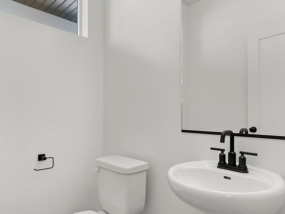 HALF BATHROOM Photos are representational of floor plan only, not specific listing. Contact agent f