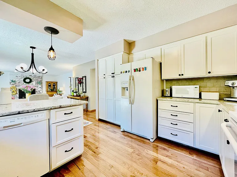Spacious Kitchen with Updated Cabinets and Large Pantry Storage.