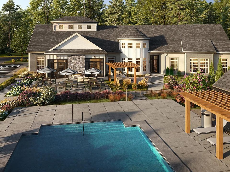 Resort-style pool with spacious sundeck and comfortable seating in Marshfield, MA.