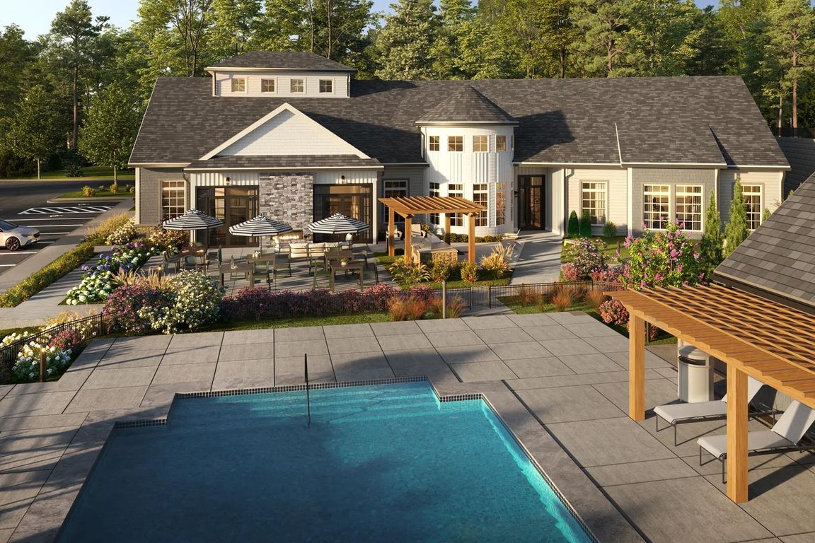 Resort-style pool with spacious sundeck and comfortable seating in Marshfield, MA.