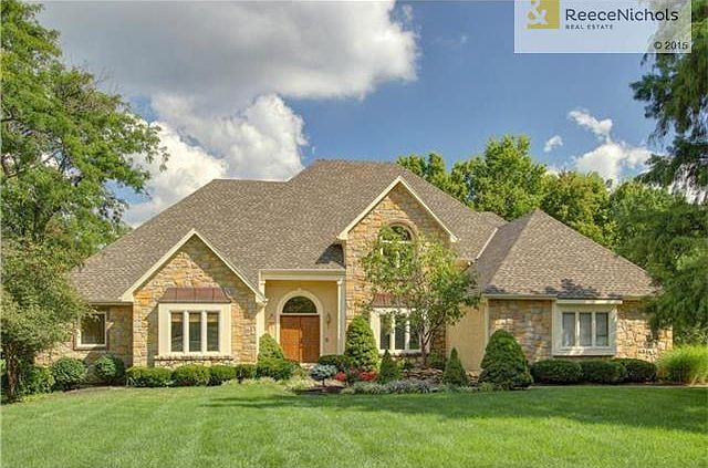 Gorgeous exterior with impeccably maintained landscaping on large lot
