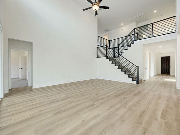 Soaring ceilings in gathering room photos may depict options and features that aren t available