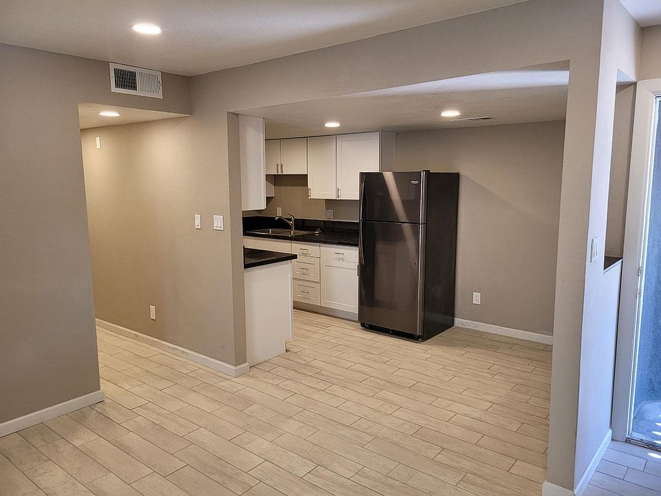 Living room facing kitchen / small dining area