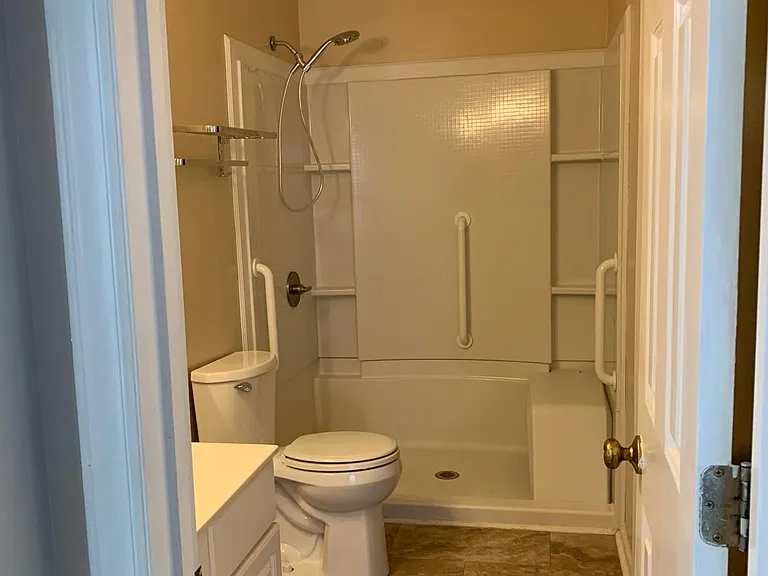 Bathroom, accessible from the hall and also from the 2nd bedroom. Full size walk-in shower, single sink.