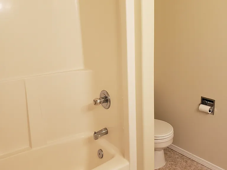 middle floor bathroom with dual sinks