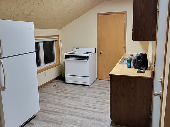 Kitchen with newer laminate floor