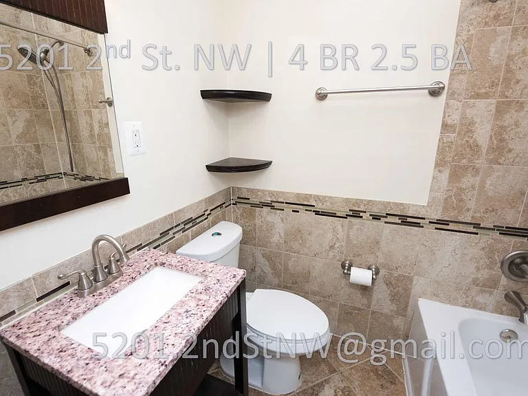 Full bath with tub and skylight on second floor.